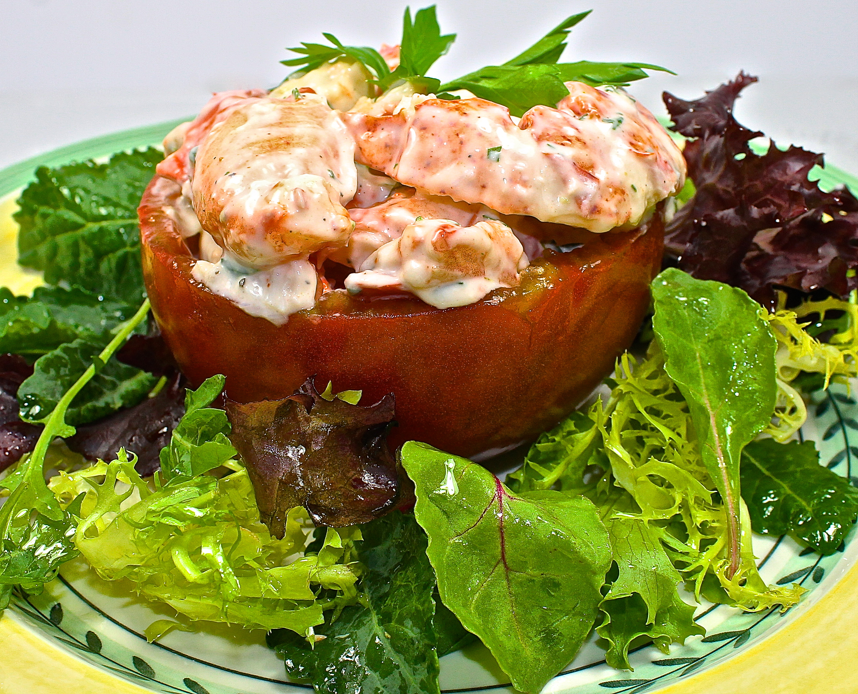 Black Krim Heirloom Tomato Stuffed With Lobster Salad On A Bed of Mixed Greens