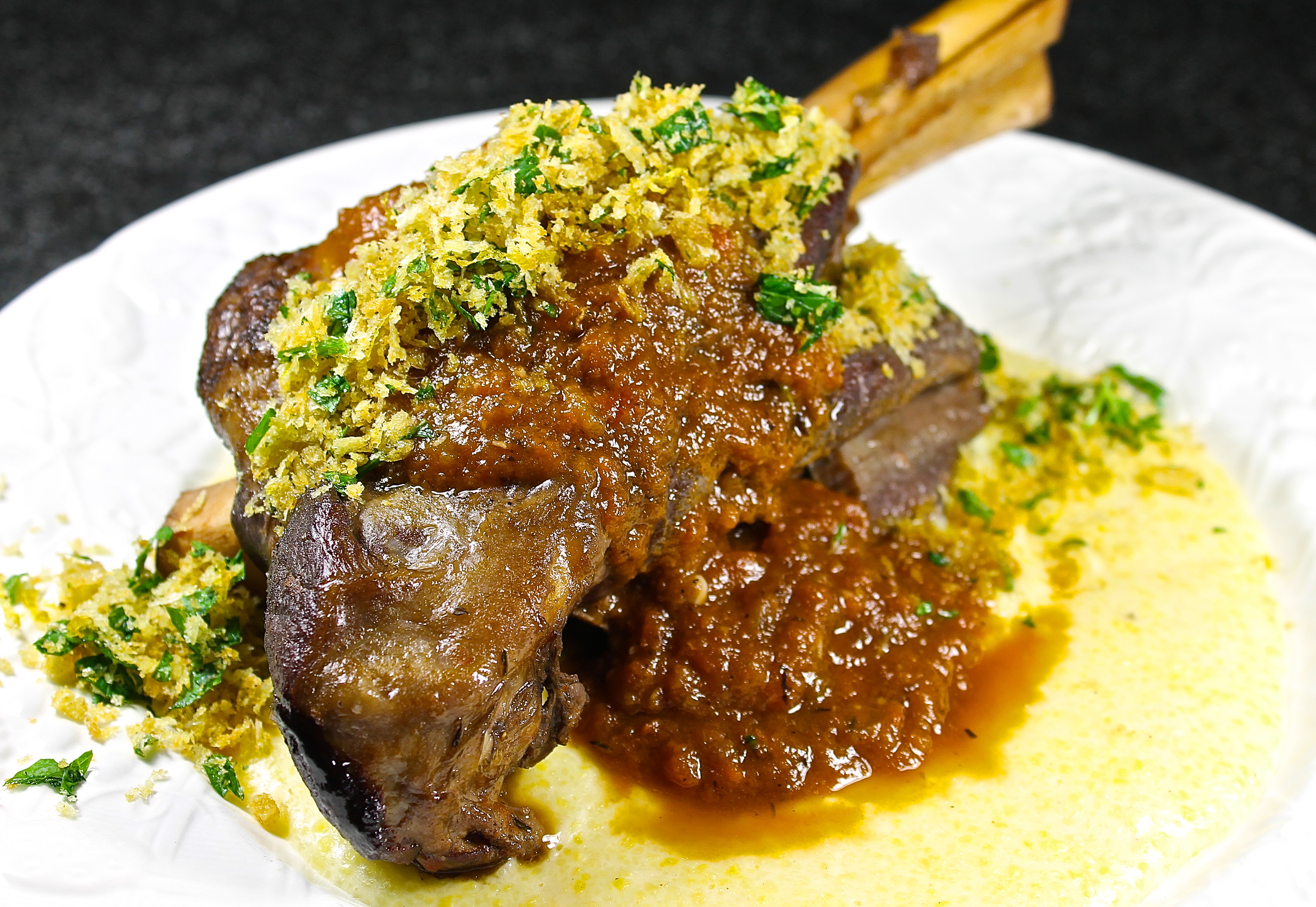 Italian Lamb Shank With Gremolata Crumbs On A Bed Of Creamy Parmesan Polenta