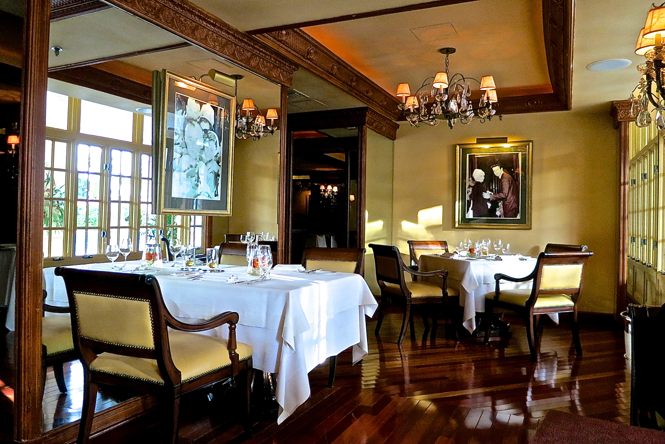 The Palme d'Or Gourmet French Restaurant With Windows Looking Out At The Pool
