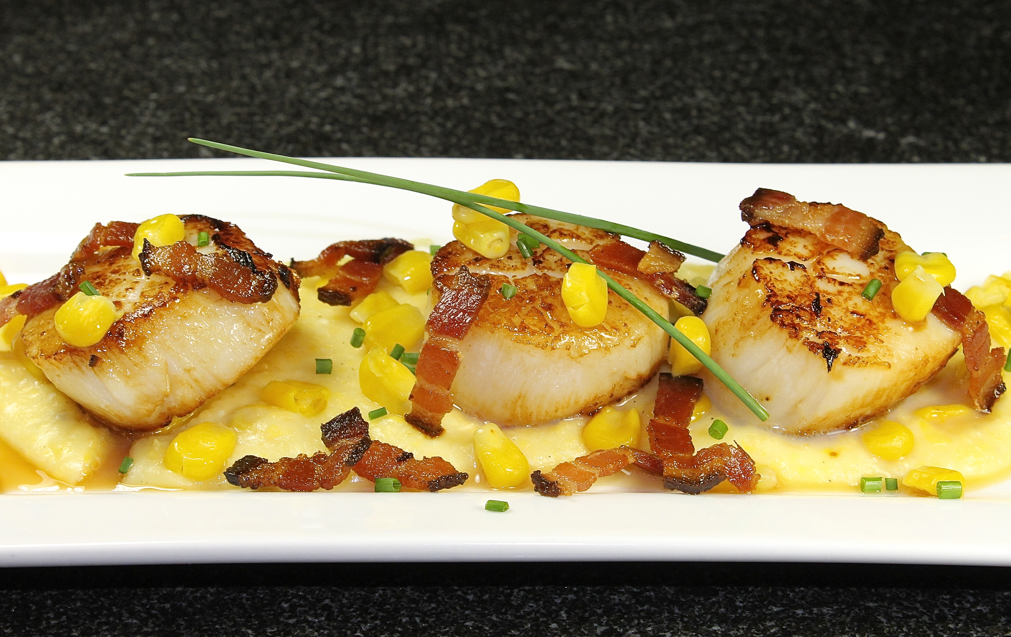 Pan Seared Sea Scallops With Bacon Lardons On Creamy Corn Polenta