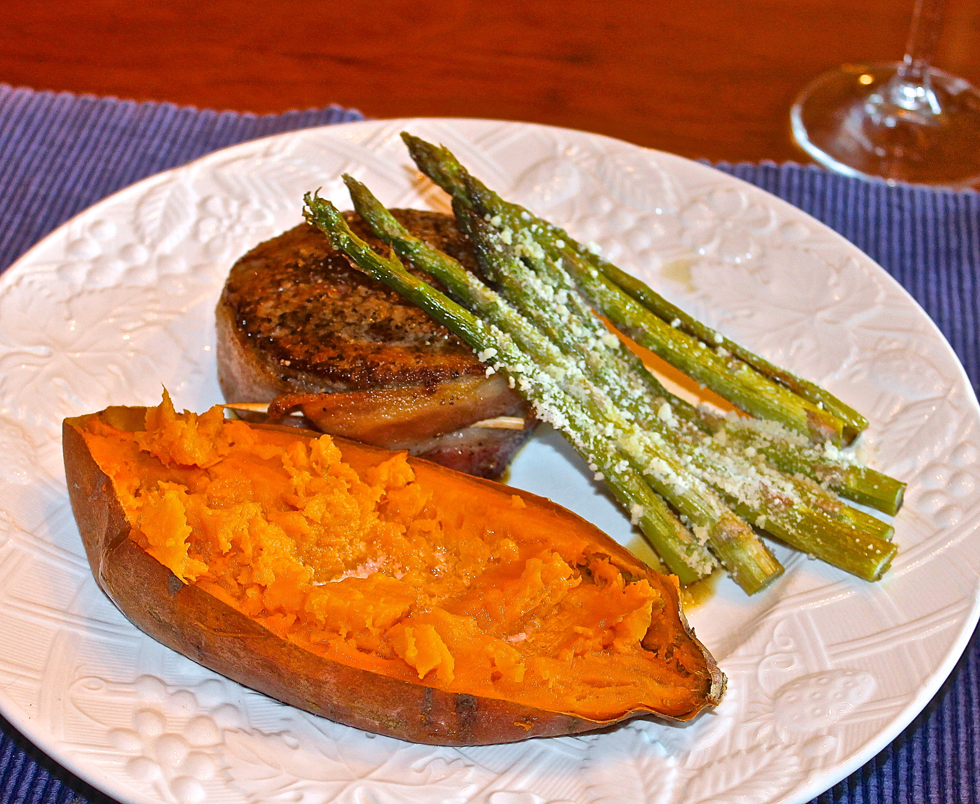 Pan Seared Bacon Wrapped Filet Mignon With A Baked Sweet Potato And Parmesan Crusted Asparagus