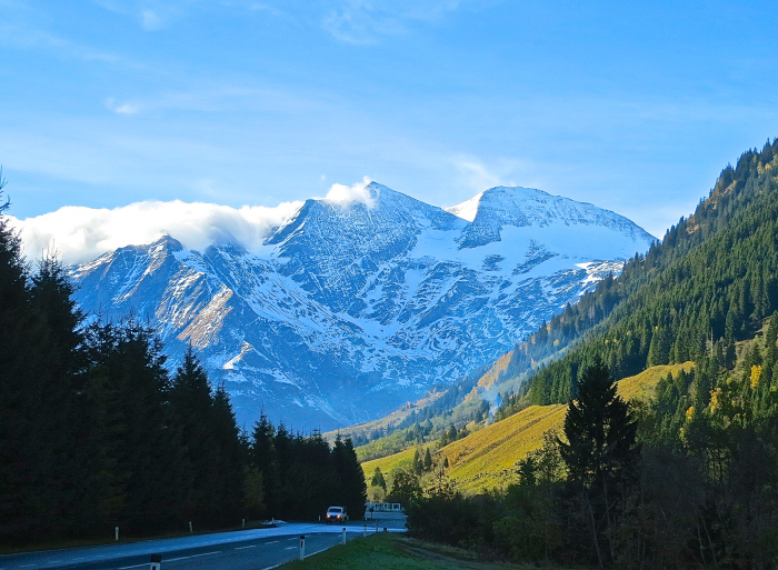 Luxury car driving through the scenic mountain passes of Hohe Tauern National Park in Austria