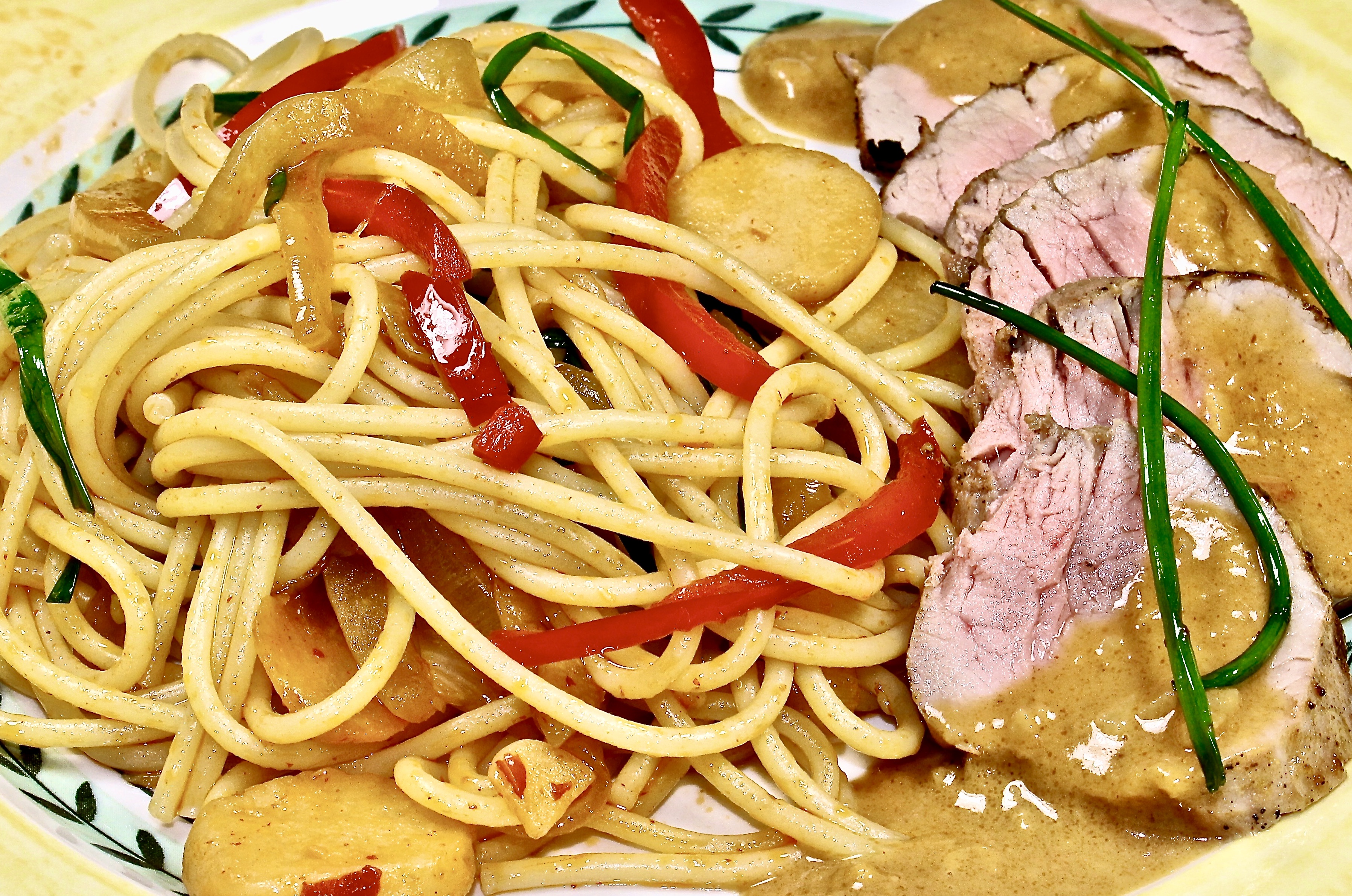 asian pork tenderloin with peanut sauce and stir-fried noodles 