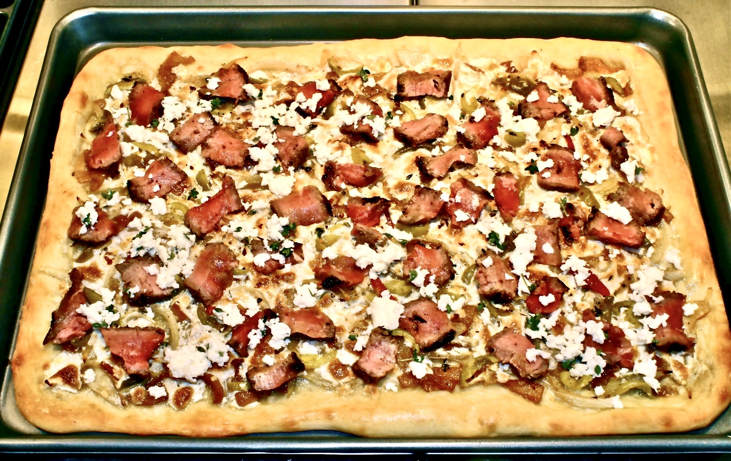 steak pizza with caramelized onion and gorgonzola 