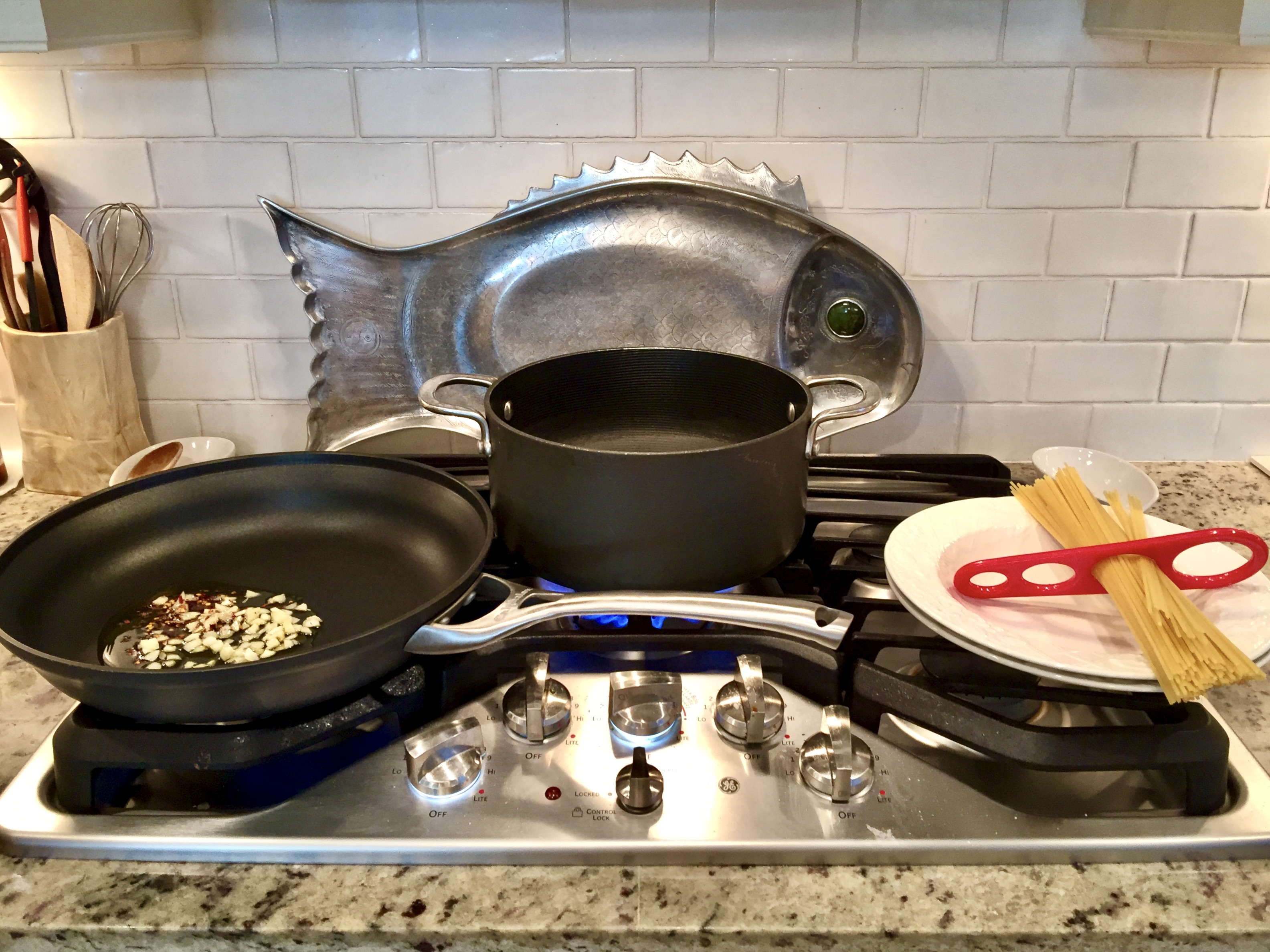 preparing pasta puttanesca