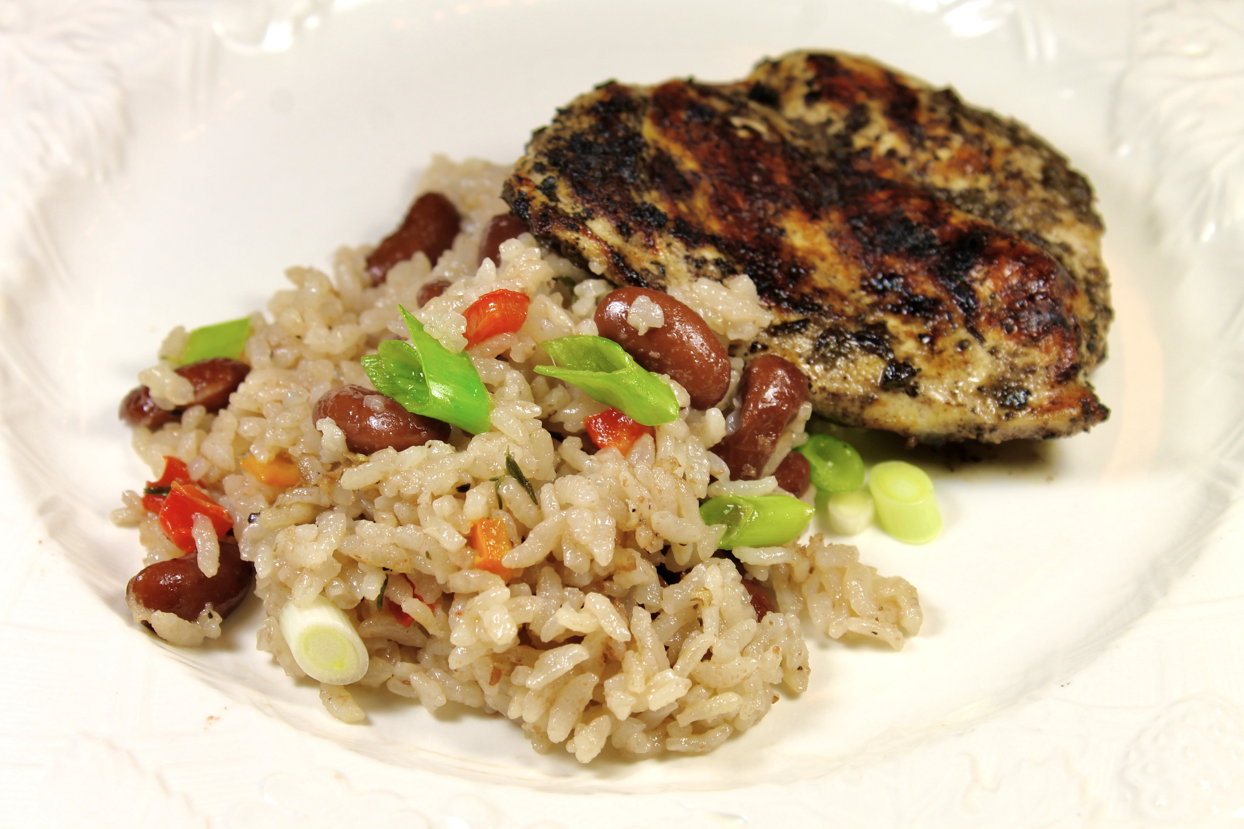Jamaican Red Beans And Rice Served With Jerk Chicken