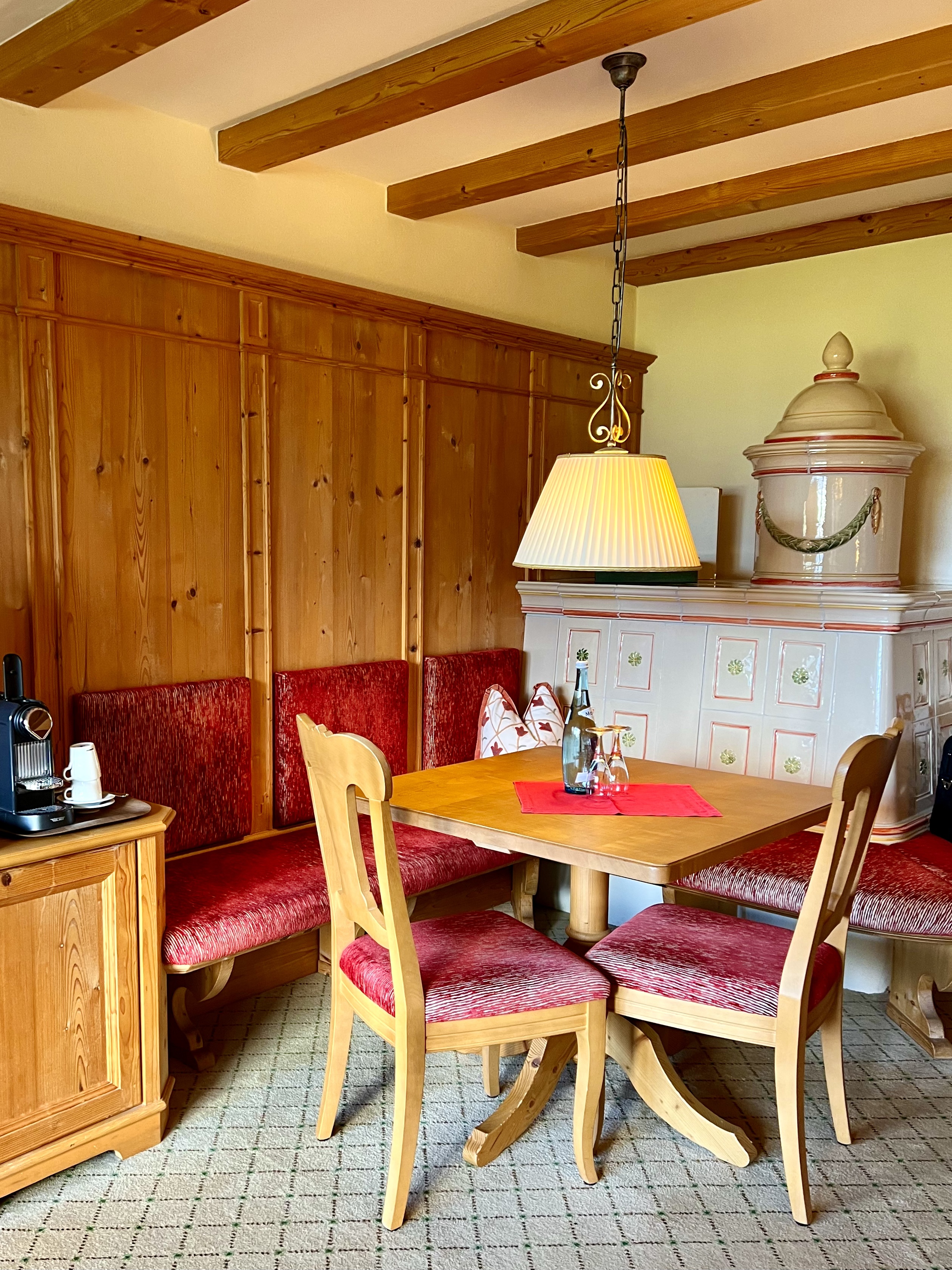 



dining nook with tiled stove
