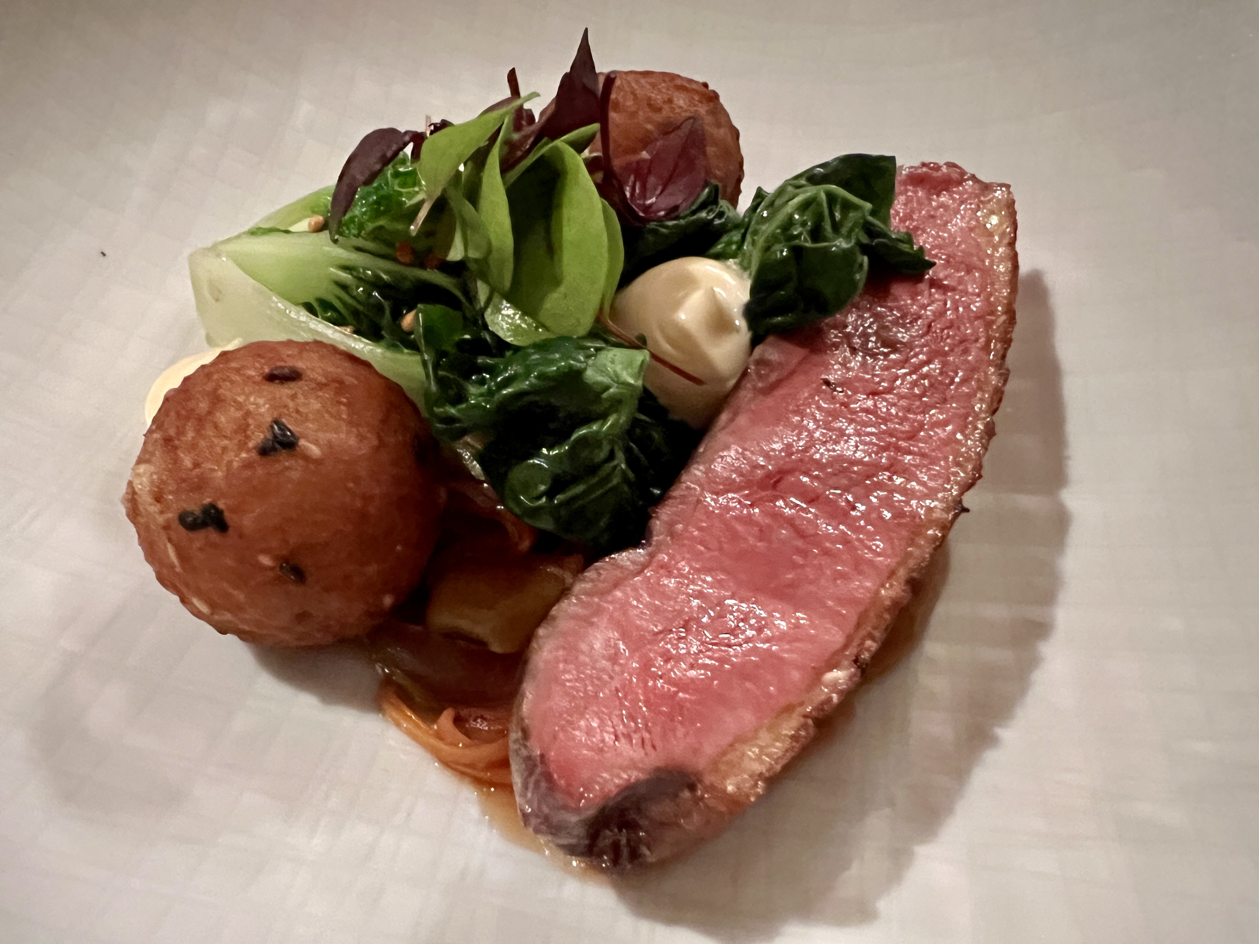duck breast, rice balls, baby bok choy