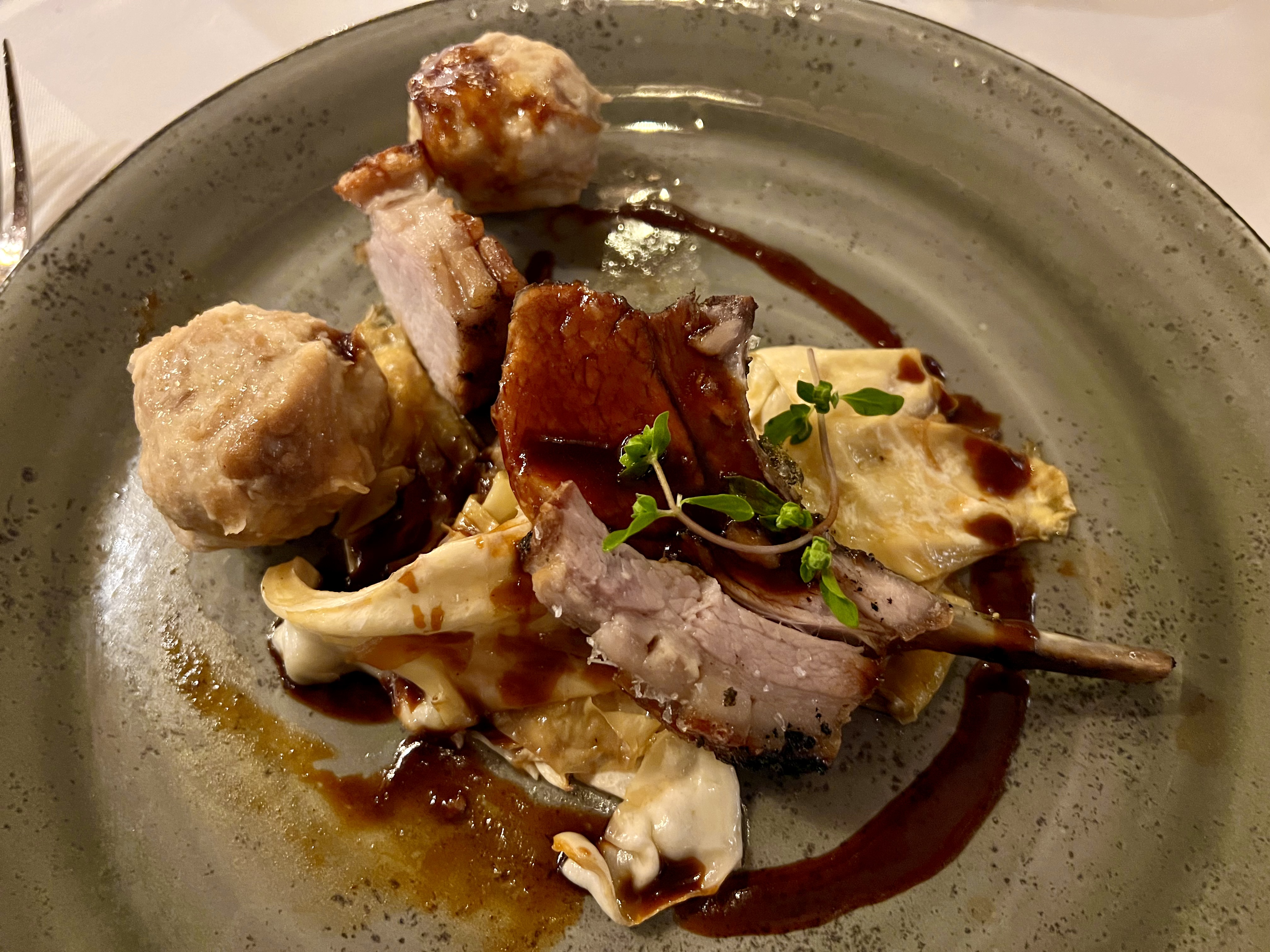 roasted saddle of pig, pretzel dumpling and cabbage