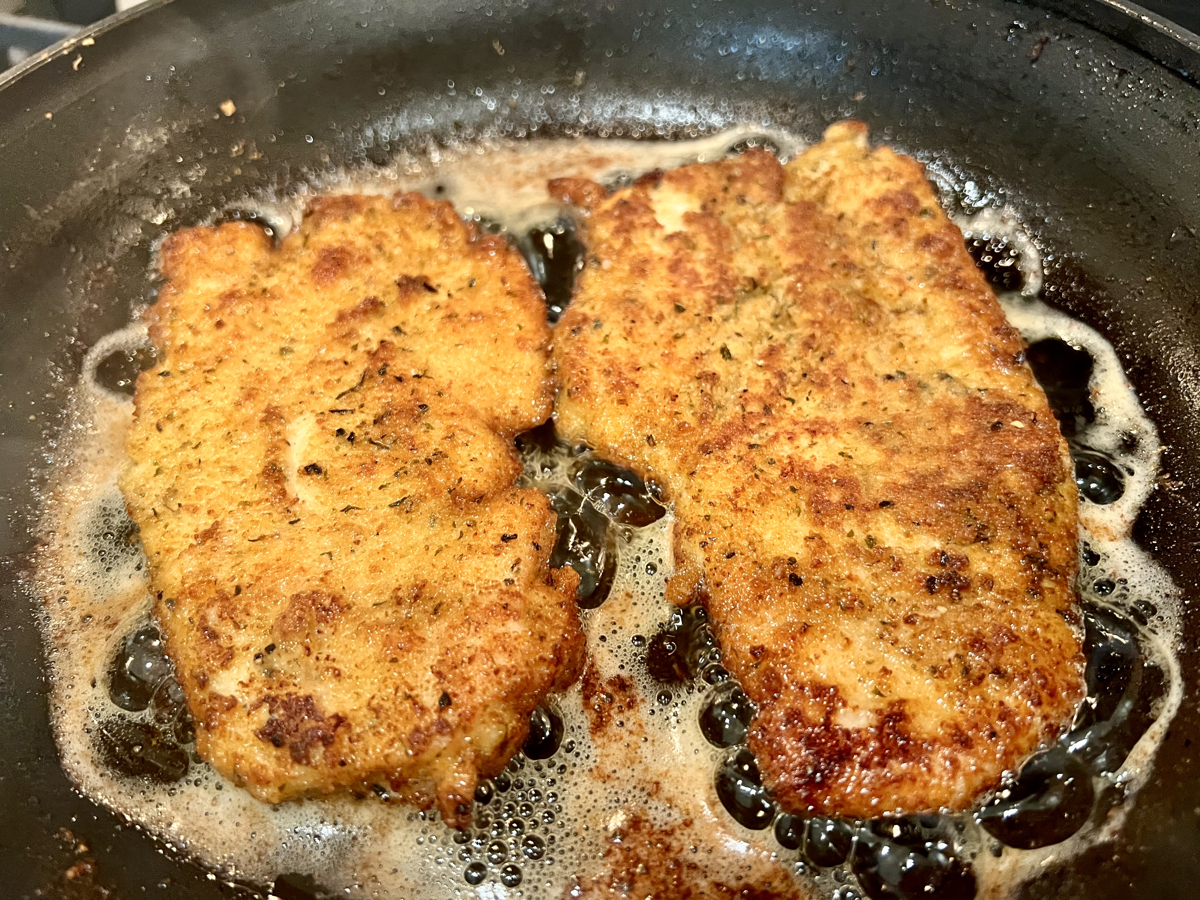 sautéing chicken cutlets until golden brown