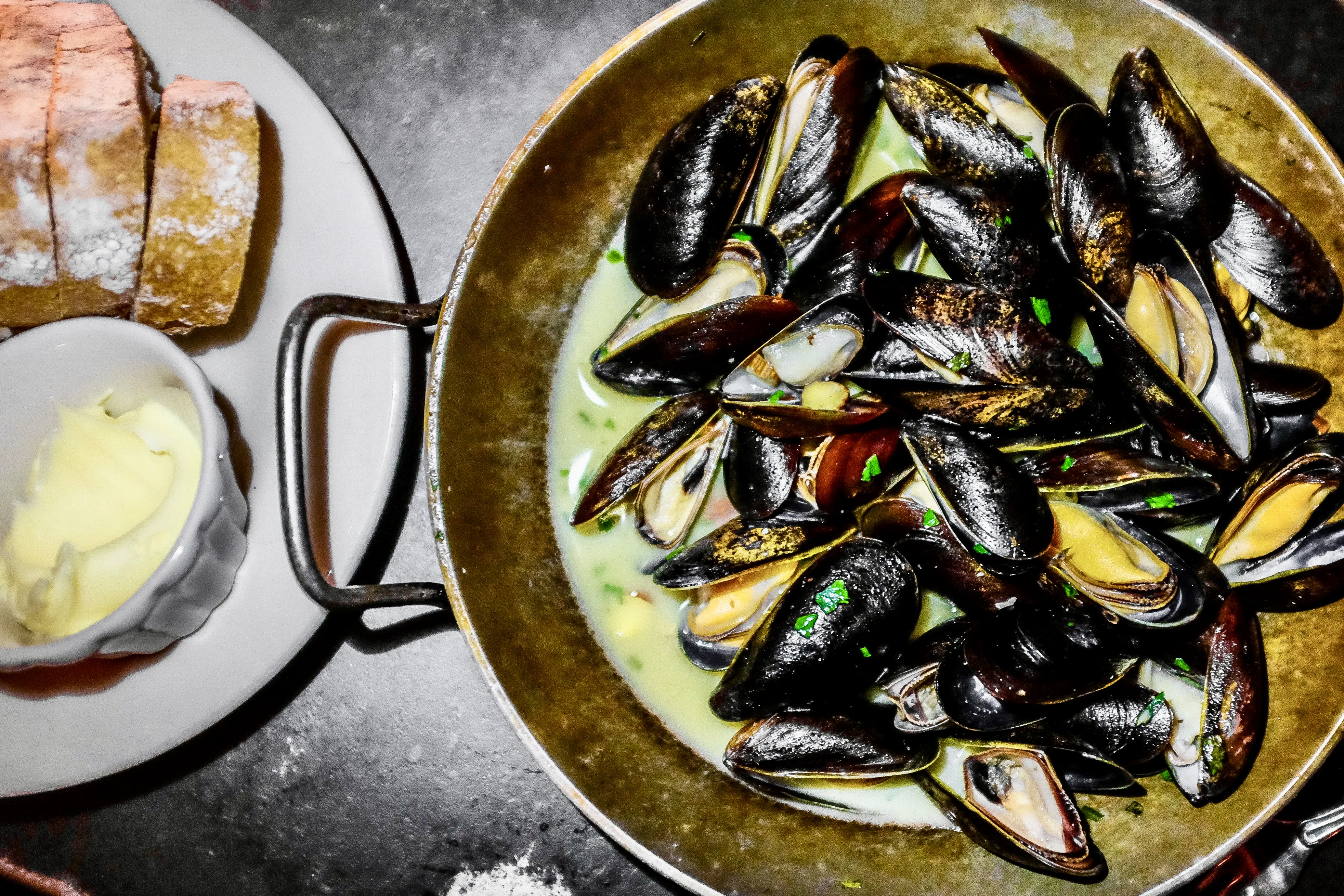 oven roasted Maine mussels in almond garlic butter