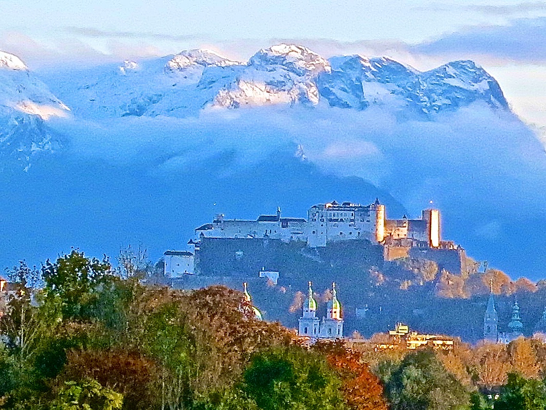 view of the Hohensalzburg Fortress from the rooftop infinity pool at hotel Gmachl on the outskirts of Salzburg